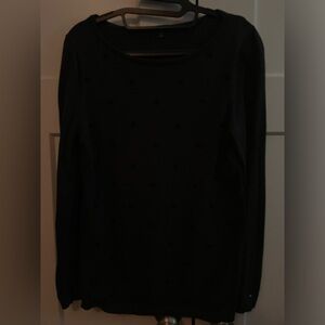 Tommy Hilfiger sweater size medium. It has rosettes of black beads on the front.